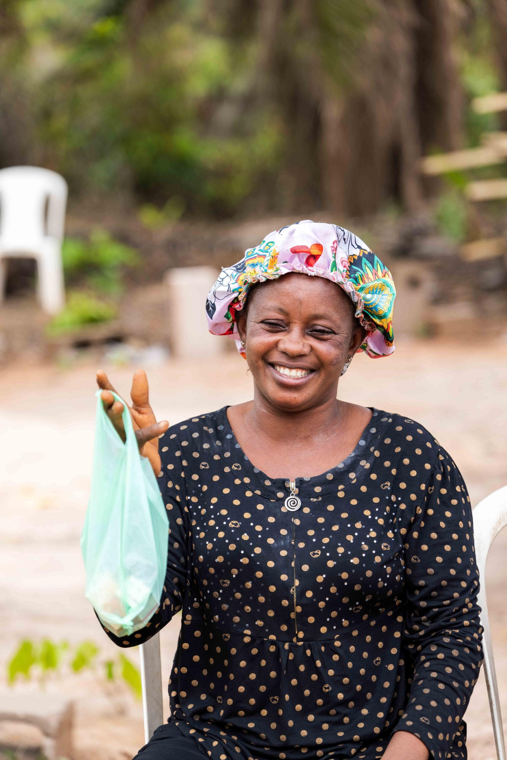 Woman holding medication from Vision Africa medical mission AOMH
