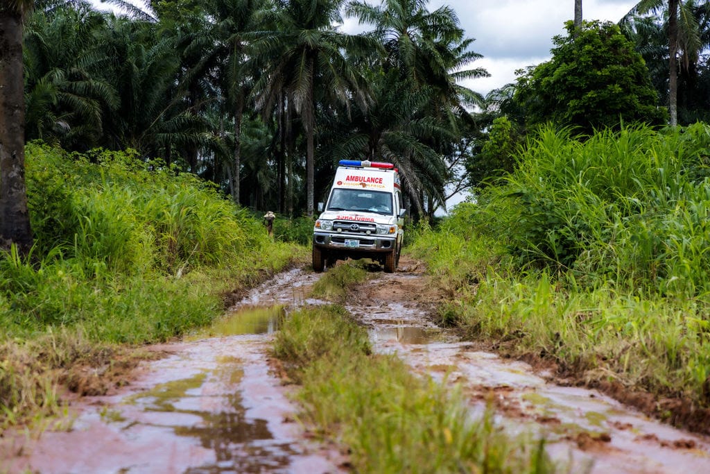 Vision Africa Ministries ambulance on muddy rural road in Nigeria