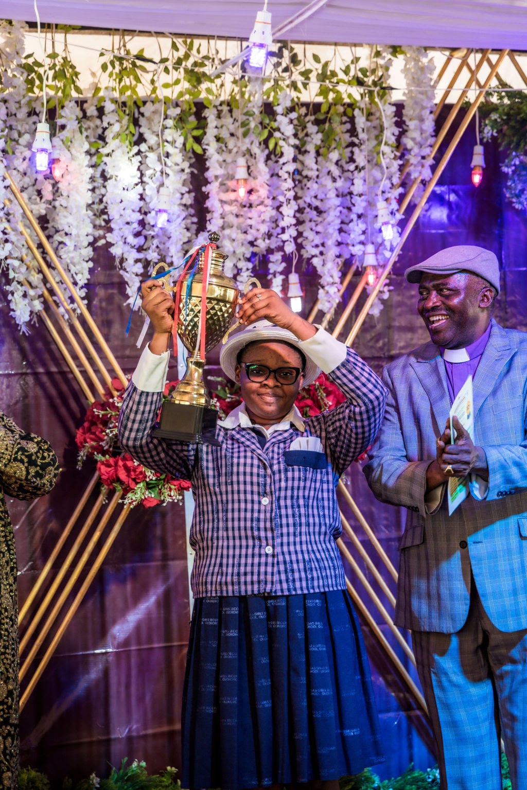 Young girl wins debate trophy at Vision Africa Ministries 
