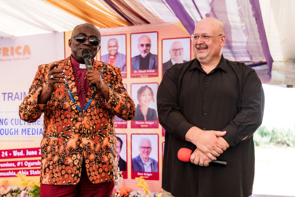 Vision Africa's Bishop Dr. Sunday Onuoha and NRB's Troy Miller on stage at Media Institute